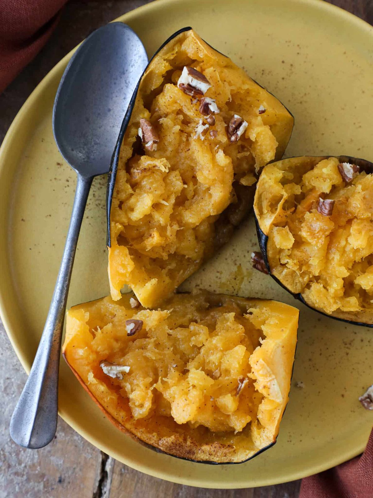 Baked Acorn Squash Halves beside the Main Plate