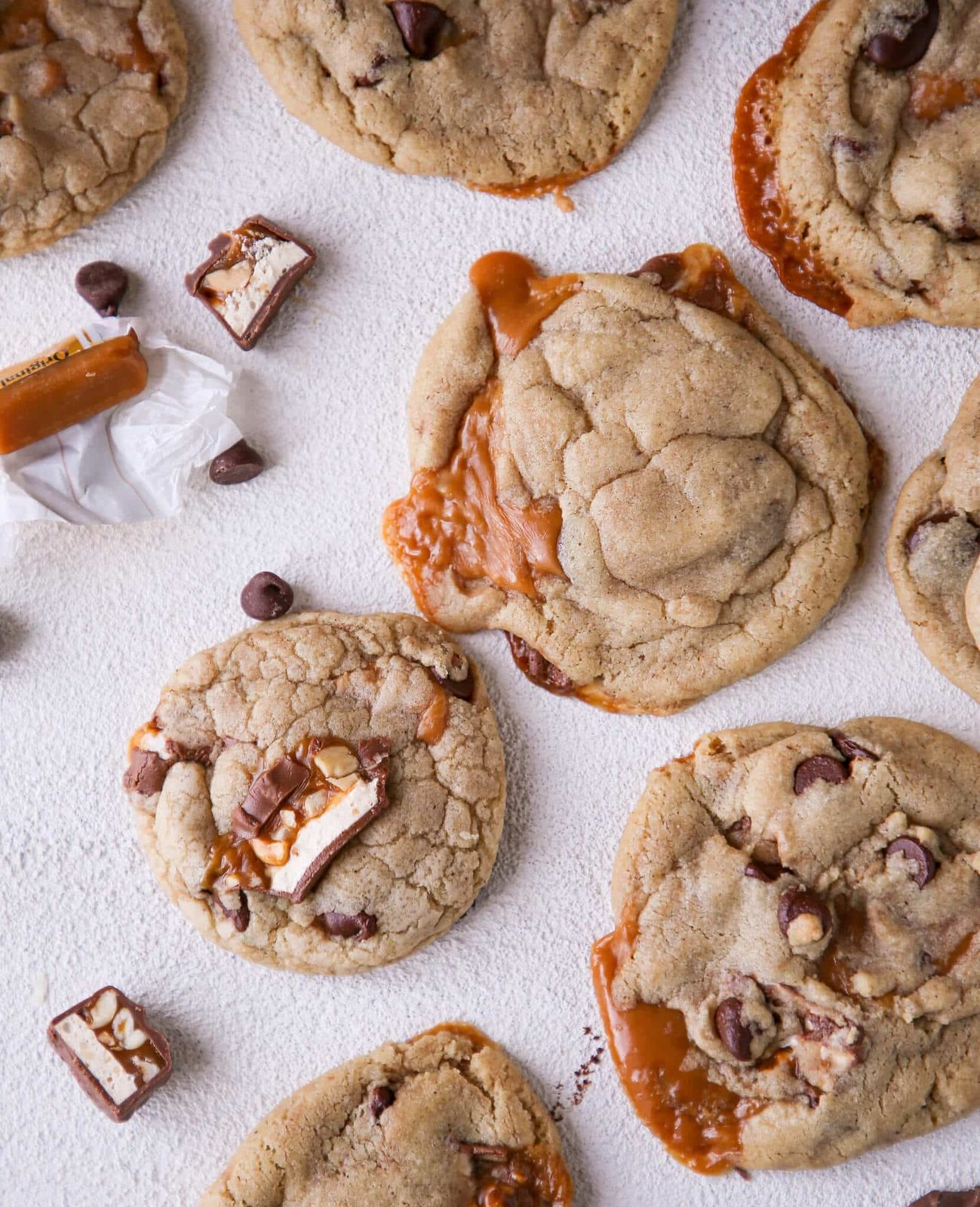 Caramel Stuffed Brown Butter Snickers Chocolate Chip Cookies with a Soft Middle