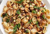 Zesty Lemon White Bean Pasta with Sun-Dried Tomatoes and Fresh Greens