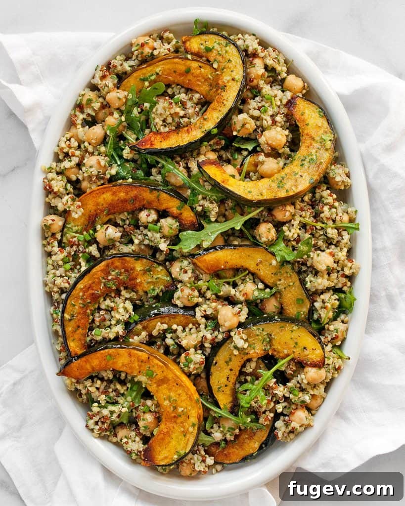 Hearty Acorn Squash and Chickpea Quinoa 2 Beautifully roasted acorn squash chickpea quinoa dish with a vibrant green pesto