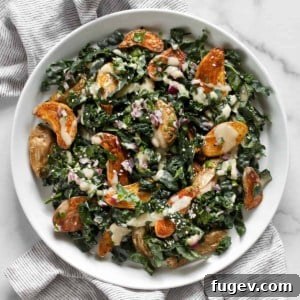 Roasted potato kale salad on a plate.