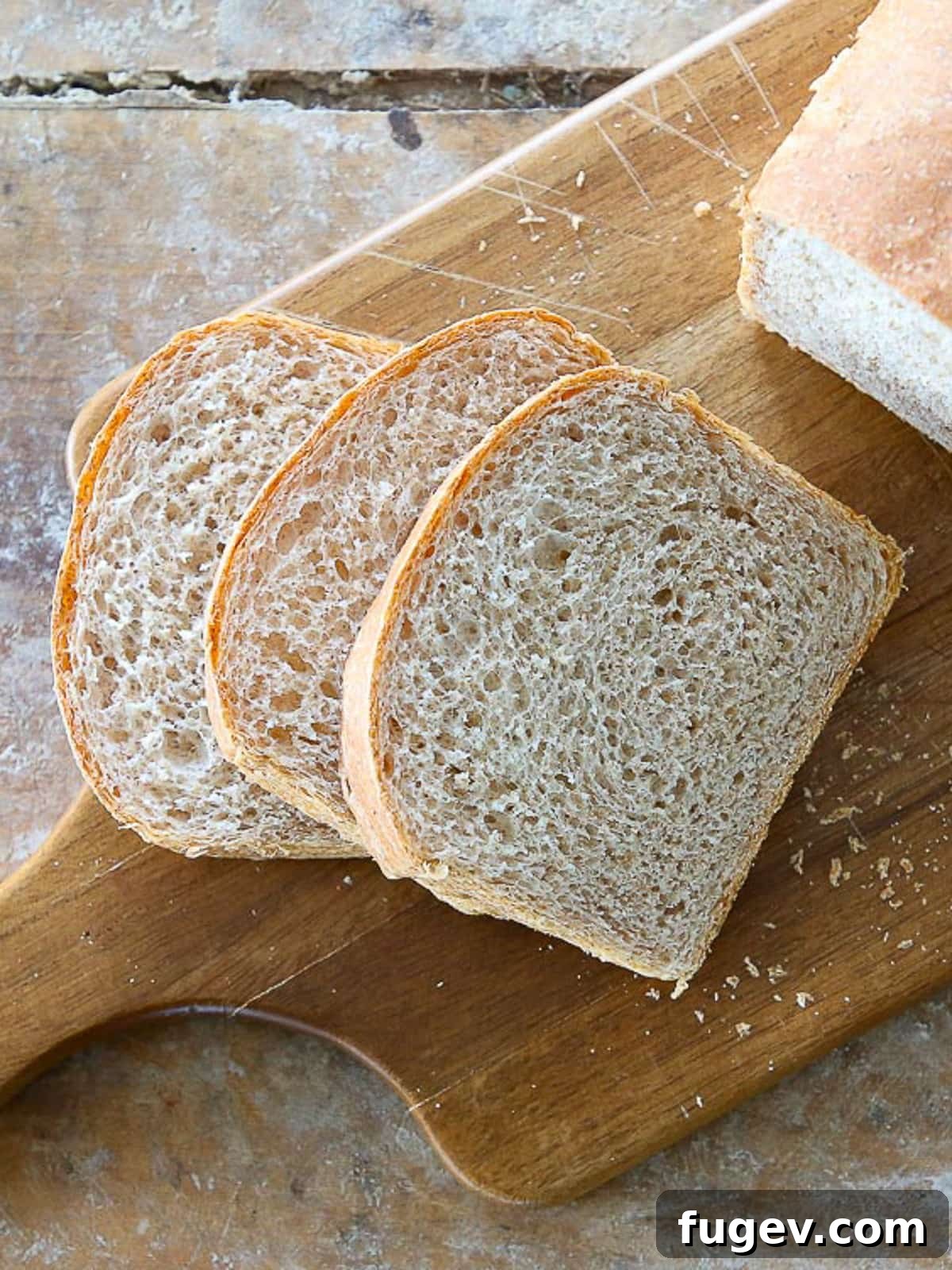 Hearty Homemade Whole Wheat Bread 2 A soft sandwich loaf with even slices revealing a tender crumb and golden crust.