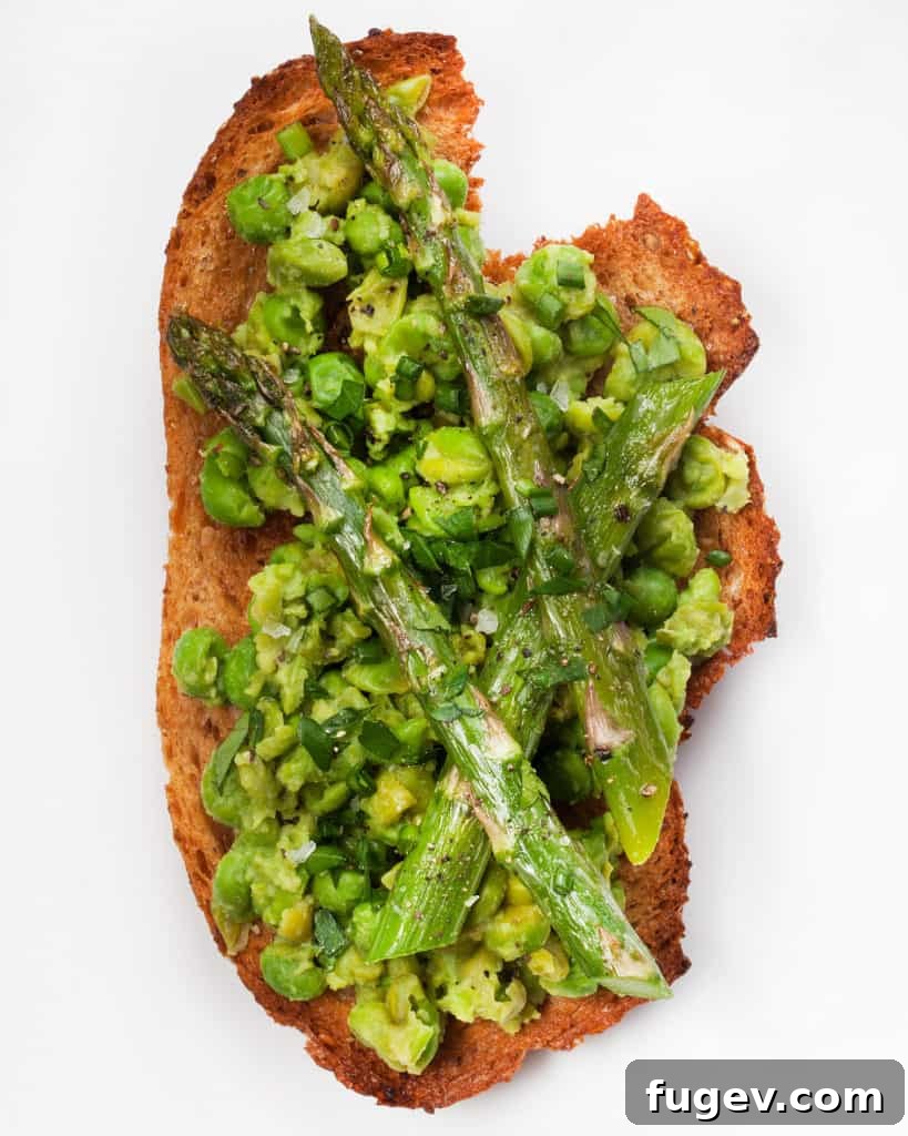 Smashed Spring Pea & Asparagus Toasts 3 Close-up of Smashed Pea Asparagus Tartines, showing the texture of the smashed peas and roasted asparagus