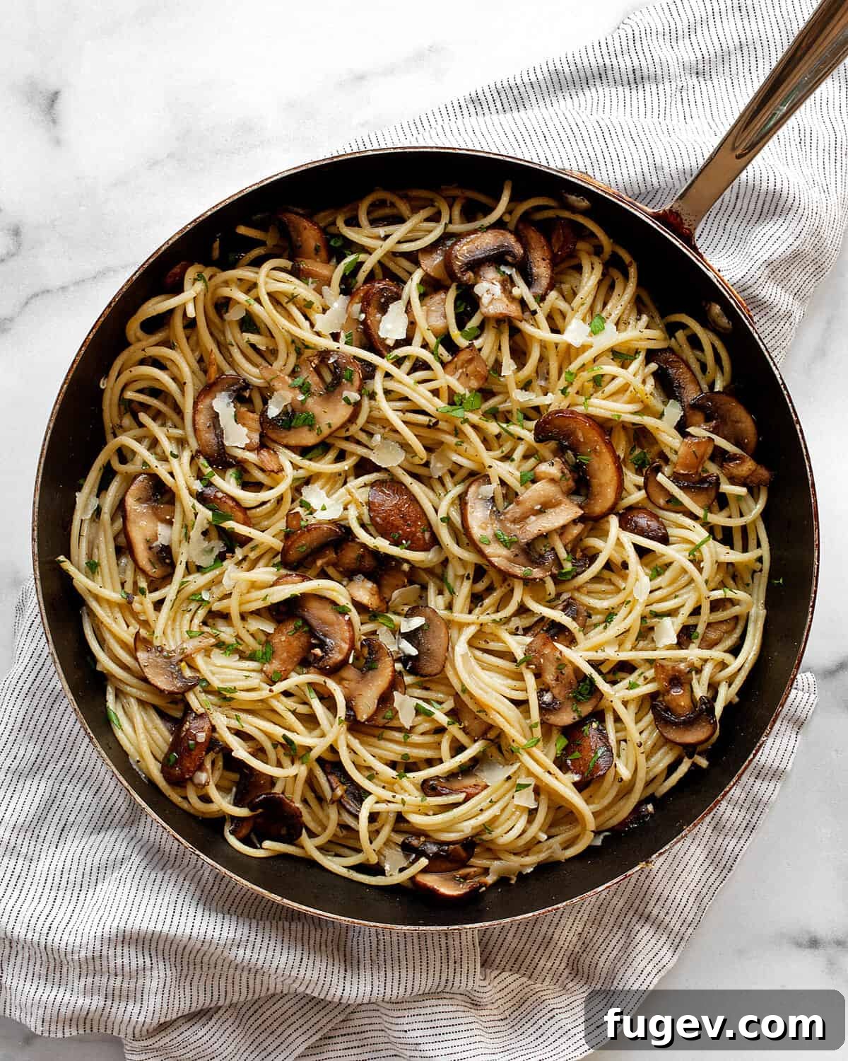 Lemon-Kissed Garlic Mushroom Pasta 2 Lemon mushroom spaghetti beautifully plated in a skillet, ready to be served.