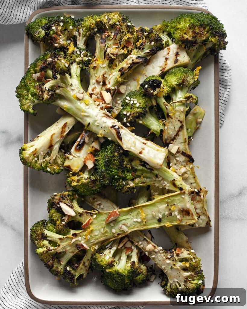 Smoky Lemon-Kissed Broccoli 2 Perfectly grilled broccoli florets on a sleek rectangular serving plate, ready to be enjoyed.