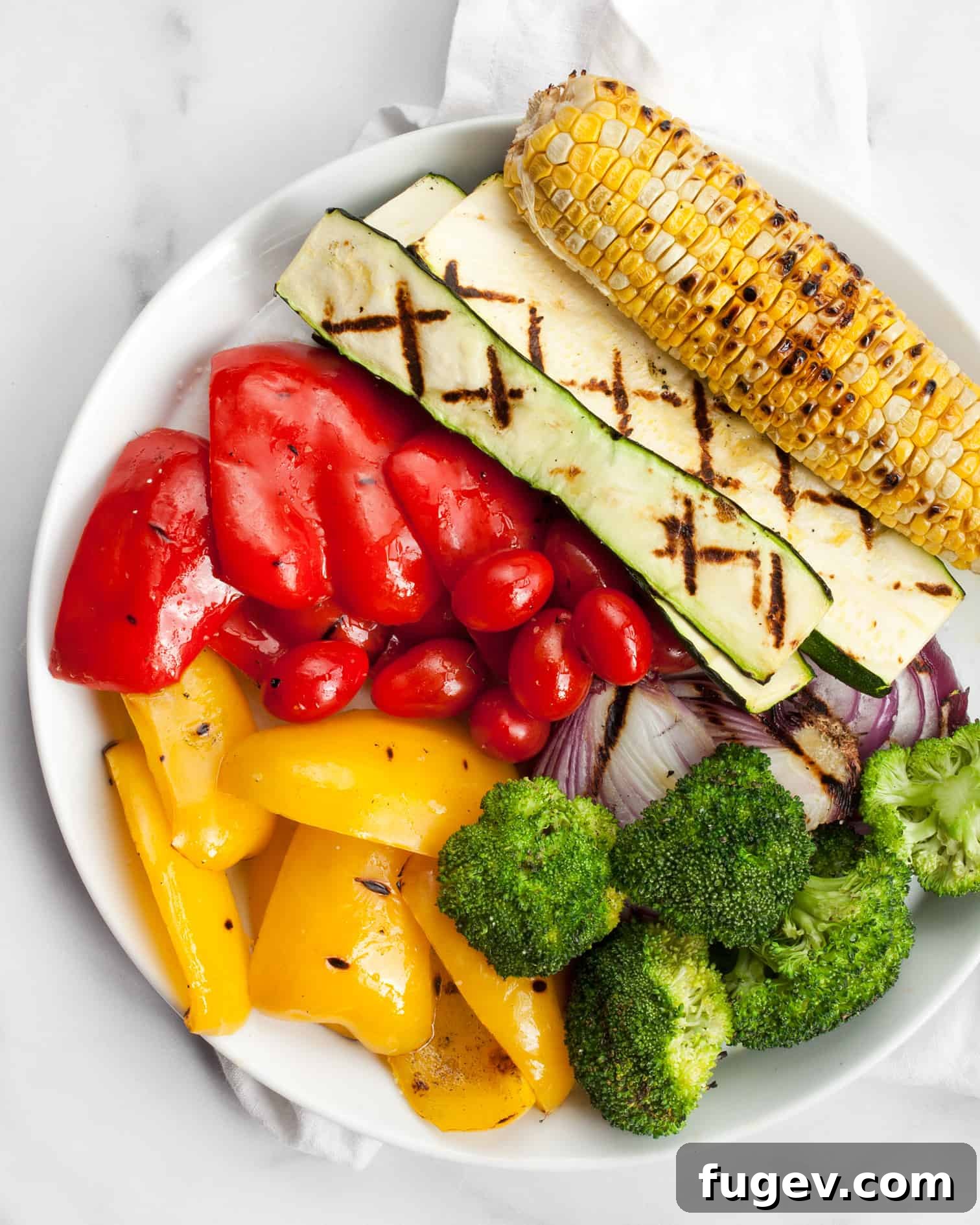 Flame-Kissed Vegetable Medley Pizza 4 Various colorful vegetables laid out, ready for the Grilled Rainbow Veggie Pizza toppings.