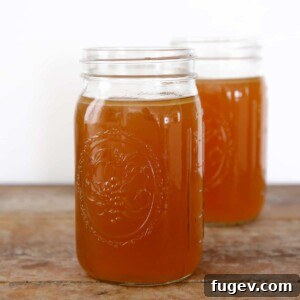 Homemade Chicken Broth in mason jars.
