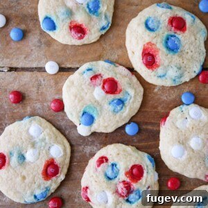 Patriotic M&M Sugar Cookies on wooden surface with m&ms