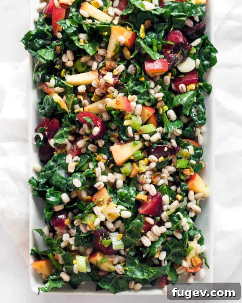 Sweet & Savory Stone Fruit Barley Kale Bowl 4 Ingredients for the Stone Fruit Kale Barley Salad, including chopped stone fruits, kale, and pistachios.