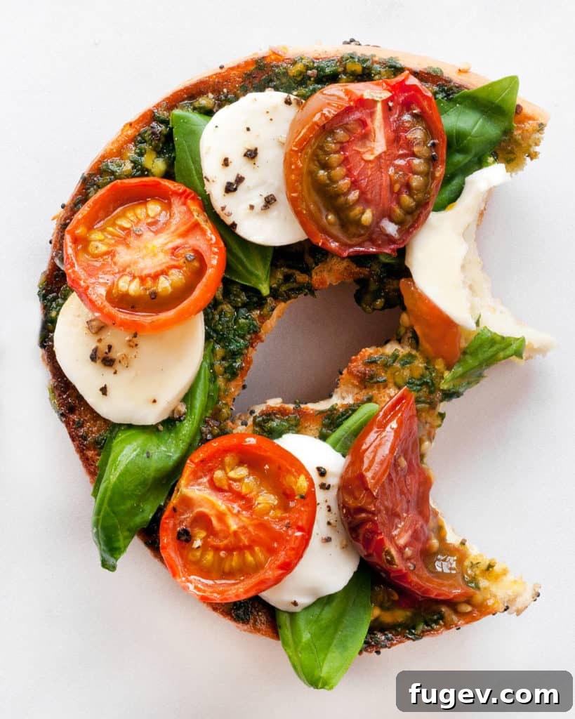 Fresh Caprese Bagel 6 Close-up of a Caprese Bagel, highlighting the roasted tomatoes, fresh mozzarella, and basil.