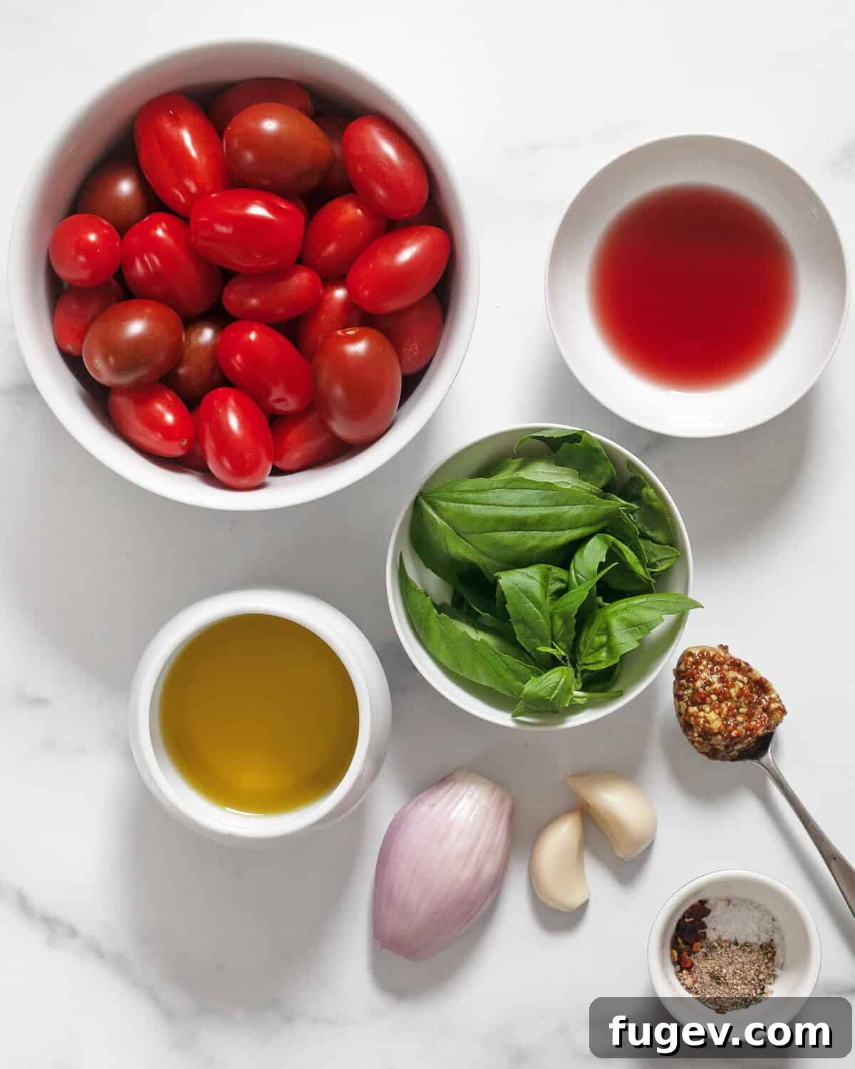 Golden Harvest Roasted Tomato Dressing 3 A flat lay photograph displaying all the essential ingredients for making roasted tomato vinaigrette, including ripe cherry tomatoes, fresh basil leaves, red wine vinegar, high-quality extra virgin olive oil, whole garlic cloves, whole grain mustard, and a sprinkle of seasonings.