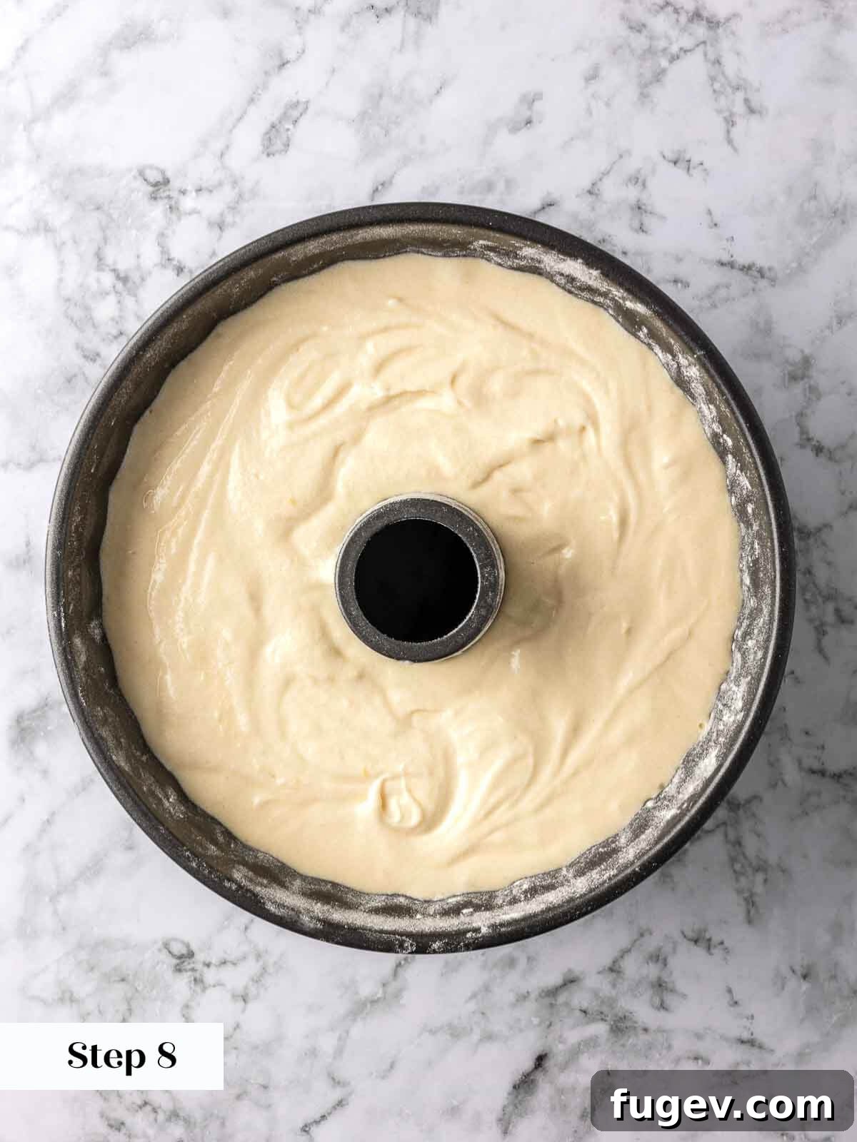 Zesty Lemon Loaf 8 Lemon pound cake batter perfectly settled in a baking pan, poised for its journey into the oven.