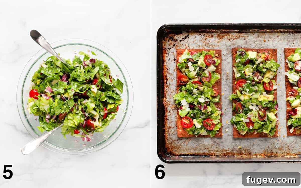 Crispy Lavash Garden Flatbread 6 A vibrant salad is tossed with dressing in a large bowl, next to two fully assembled salad pizzas on a sheet pan, ready to be enjoyed.