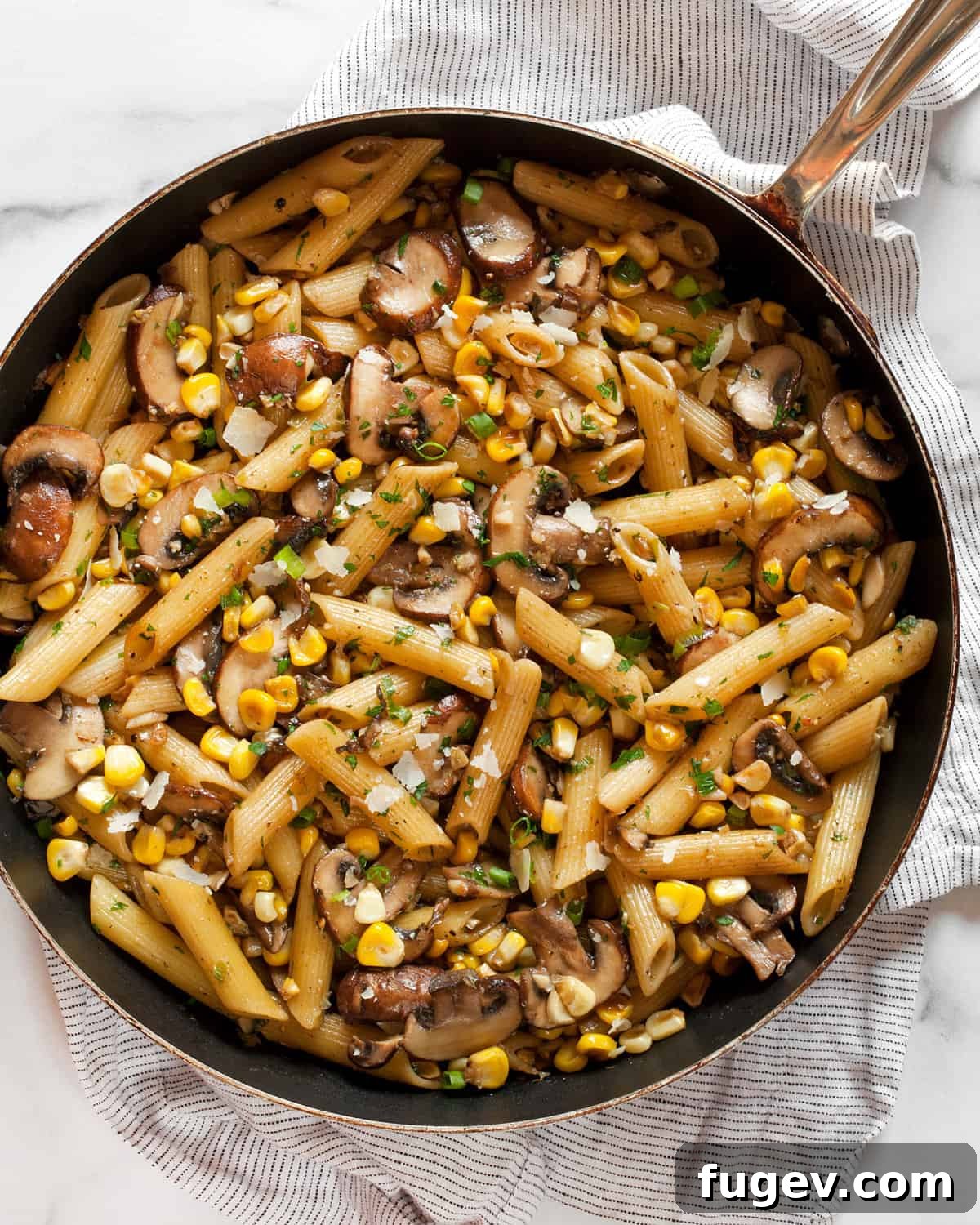 Savory Mushroom Sweet Corn Pasta 2 Vibrant mushroom and corn pasta served in a rustic skillet.