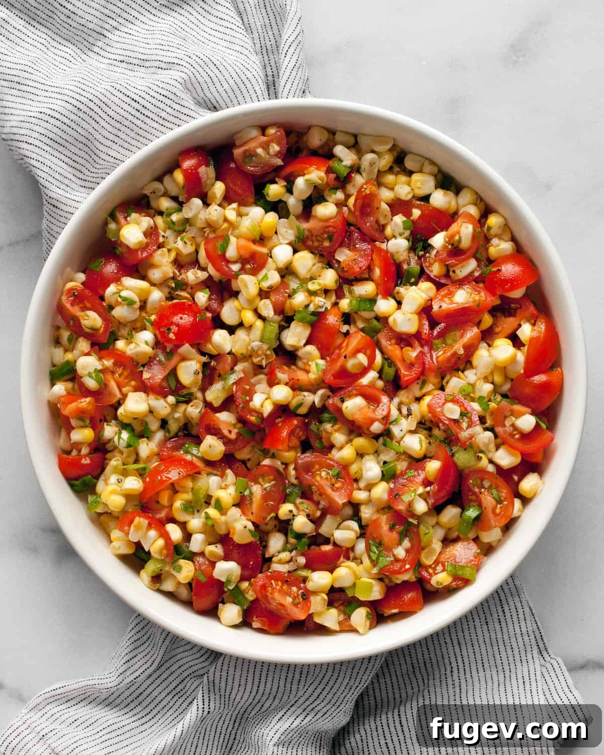 Vibrant Summer Corn and Tomato Salad 2 A beautifully presented bowl of fresh corn and tomato salad, highlighting the vibrant colors and fresh ingredients.