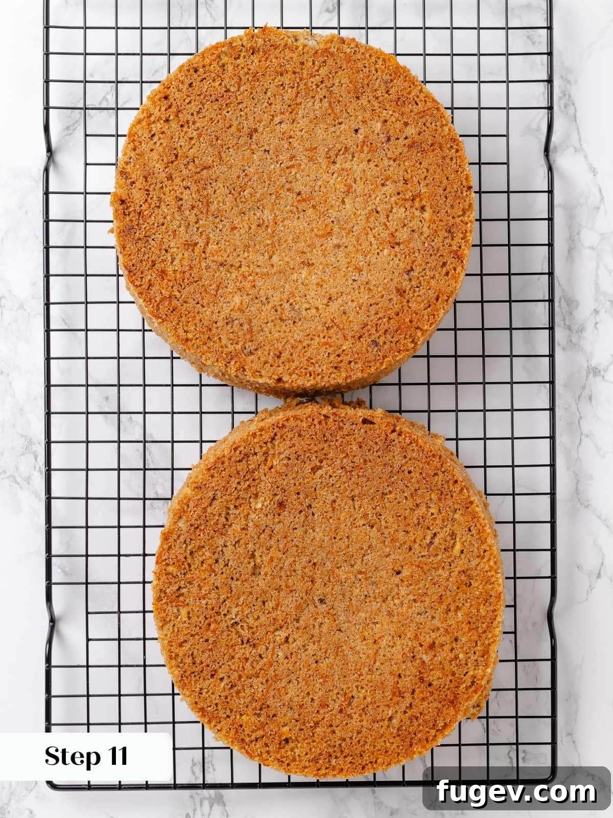 Irresistible Homemade Carrot Cake 15 Baked carrot cake layers cooling upside-down on a wire rack, a technique for achieving flat, even layers.