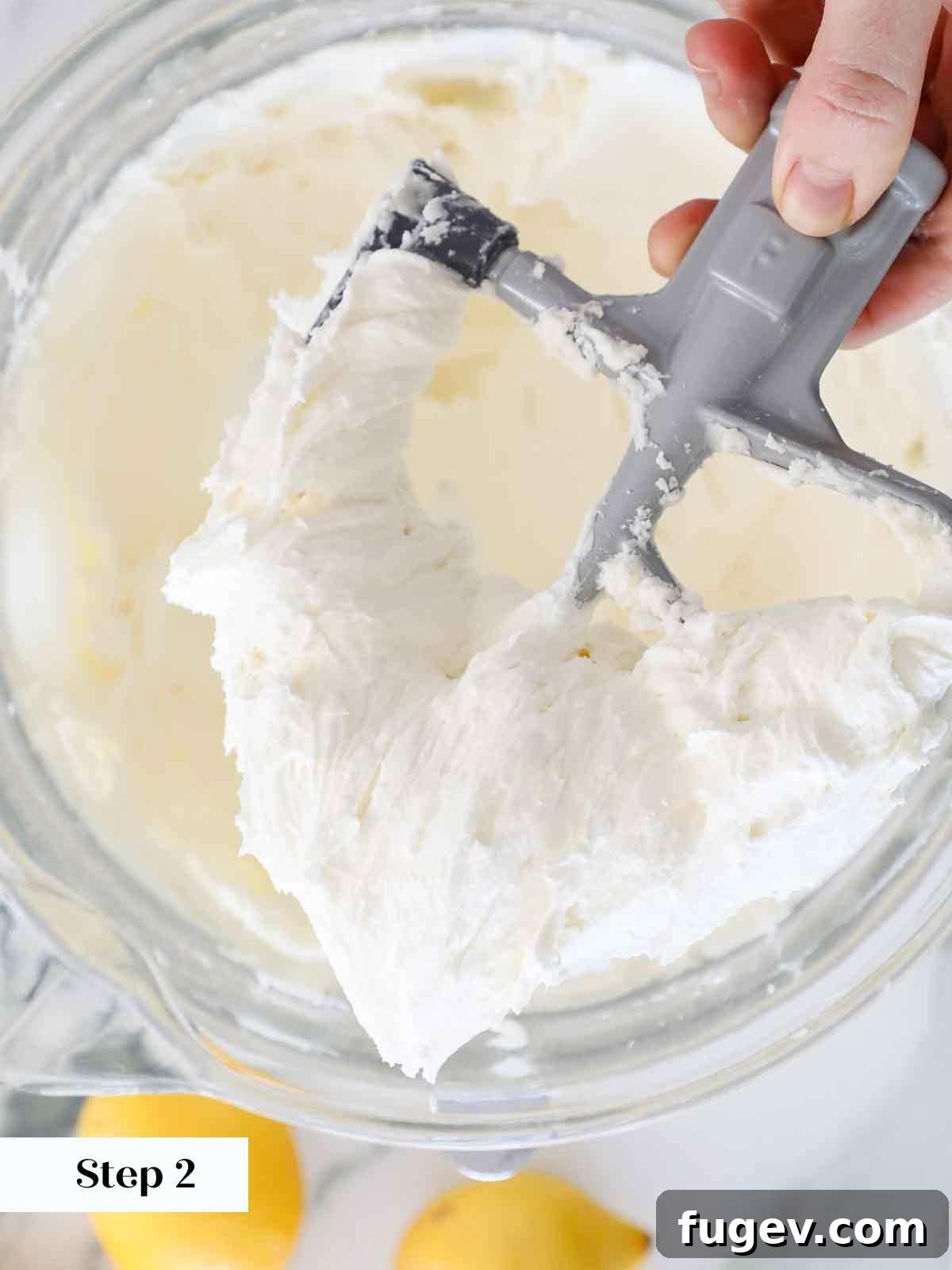Sunshine Lemon Cloud Frosting 6 Light and fluffy lemon buttercream frosting on a paddle attachment of a stand mixer.