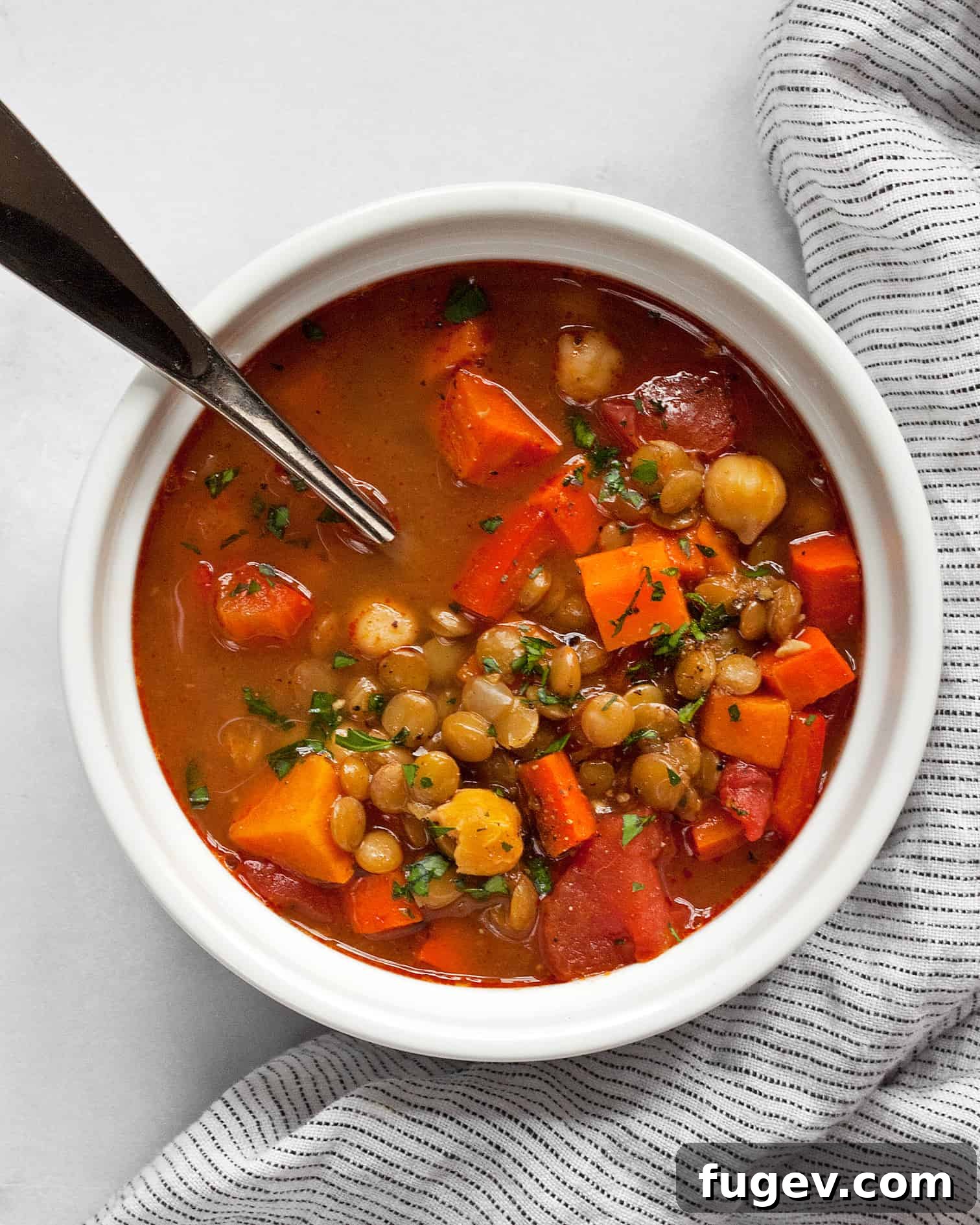 Spiced Slow Cooker Moroccan Chickpea Stew 3 A close-up shot of the simmering Slow Cooker Moroccan Chickpea Stew, showcasing its rich texture and vibrant colors.