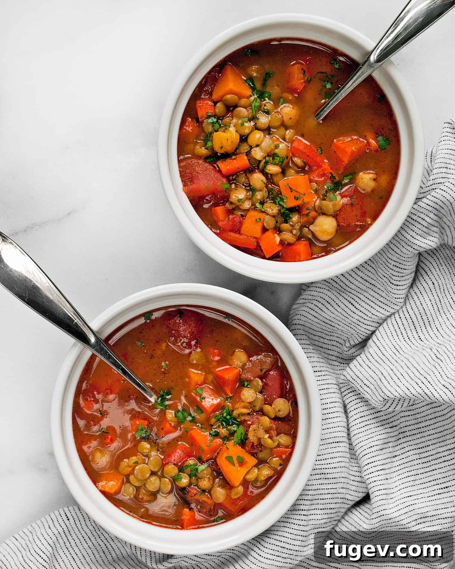 Spiced Slow Cooker Moroccan Chickpea Stew 7 A serving of Slow Cooker Moroccan Chickpea Stew in a bowl, garnished with fresh parsley.