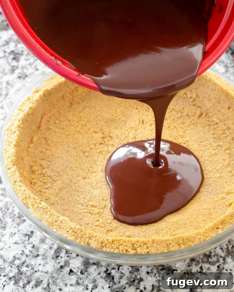 Effortless Graham Cracker No-Bake Crust 3 Close-up of no-bake graham cracker crust in a pie dish, showcasing its texture.