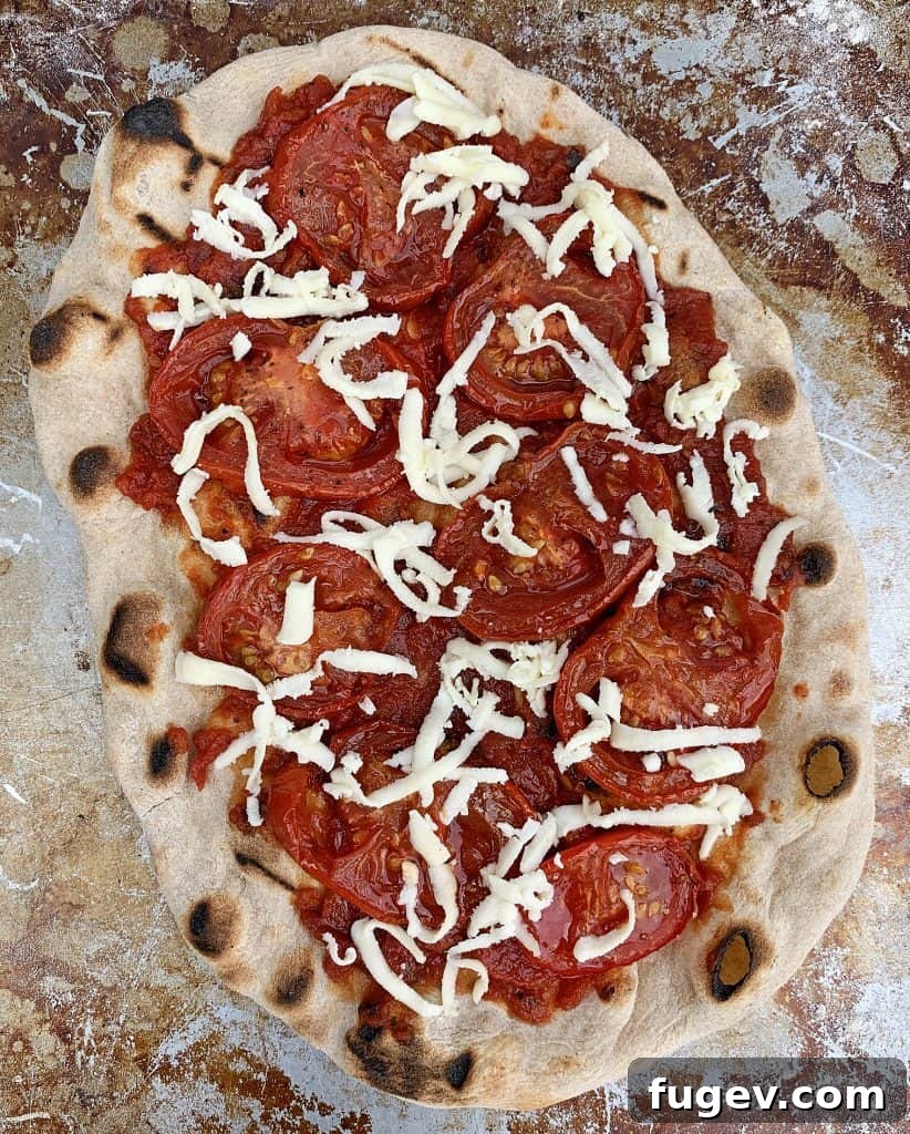 Crispy Grilled Pizza Delights 7 Adding toppings to a partially grilled pizza crust, including sauce, cheese, and fresh ingredients.