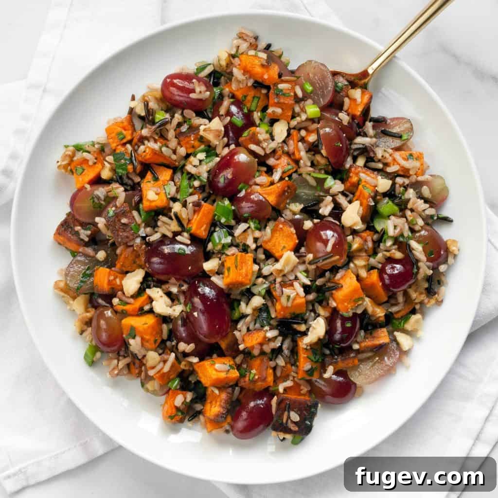 Sweet Potato Wild Rice and Grape Medley 5 Fresh red grapes and herbs being added to the cooked wild rice and sweet potatoes.