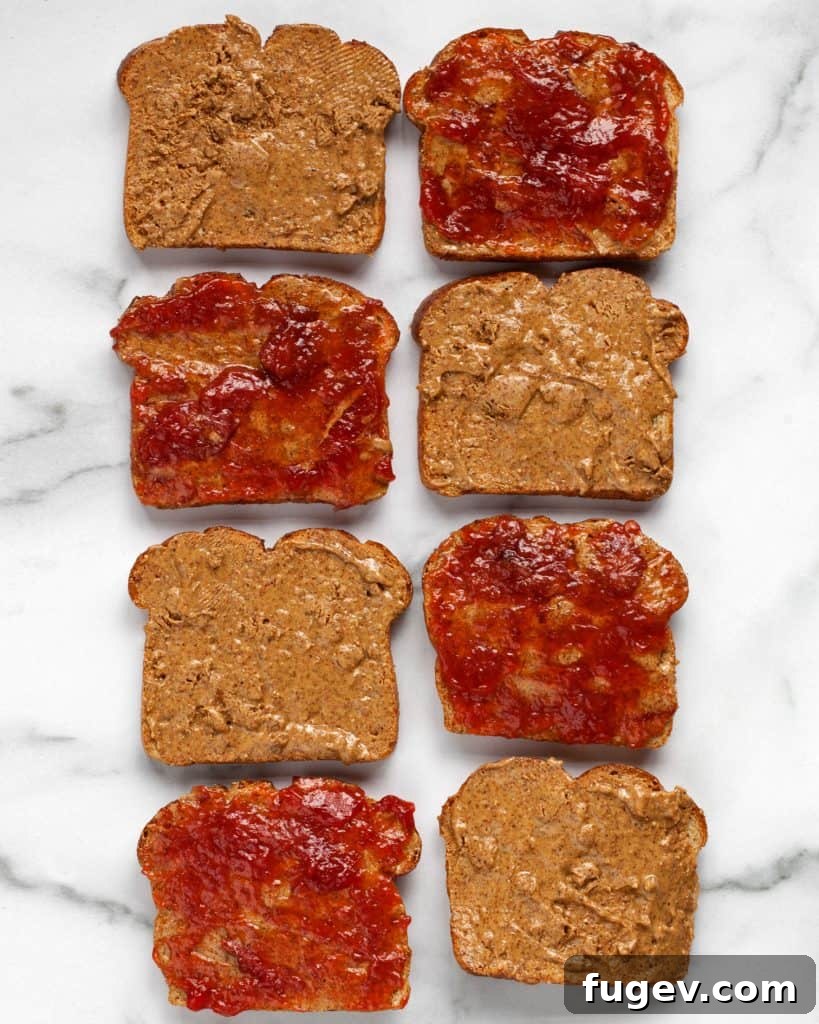 Almond Butter & Jelly French Toast Bake 5 Spreading almond butter and jelly on slices of bread