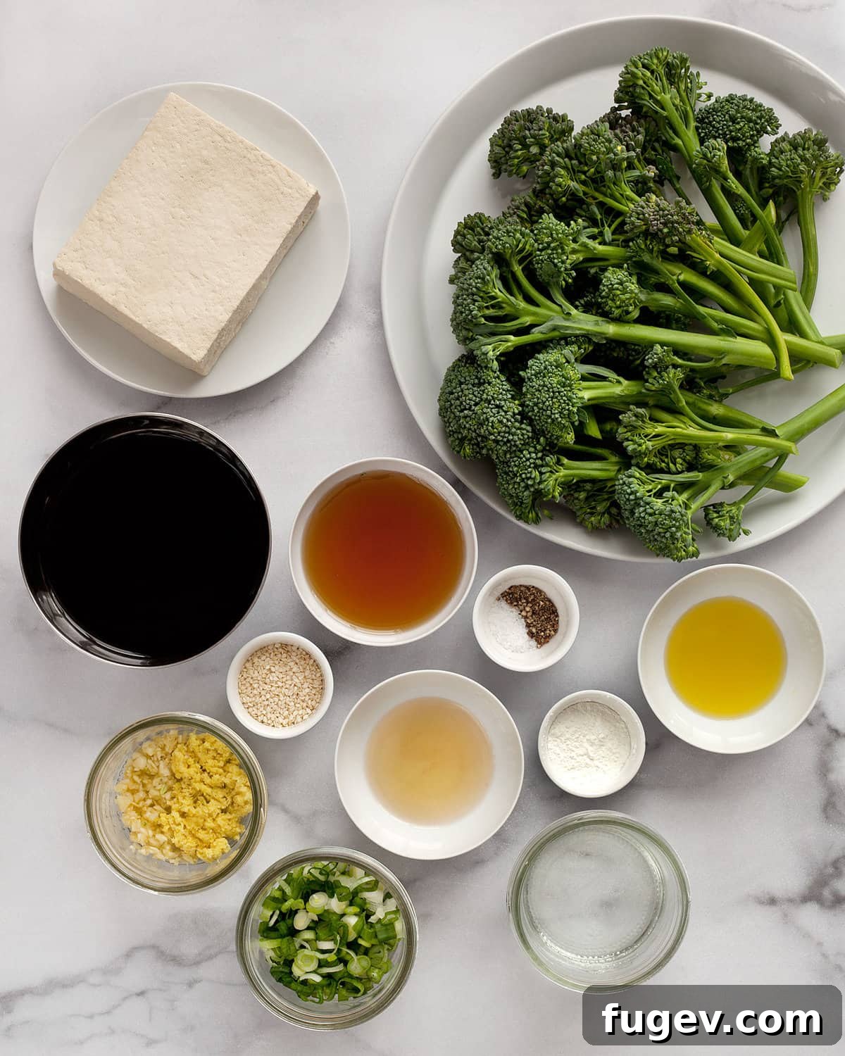 Glazed Teriyaki Tofu & Broccolini Sheet Pan Meal 3 Ingredients including tofu, broccolini, soy sauce, garlic, ginger, oil, salt, pepper and maple syrup.
