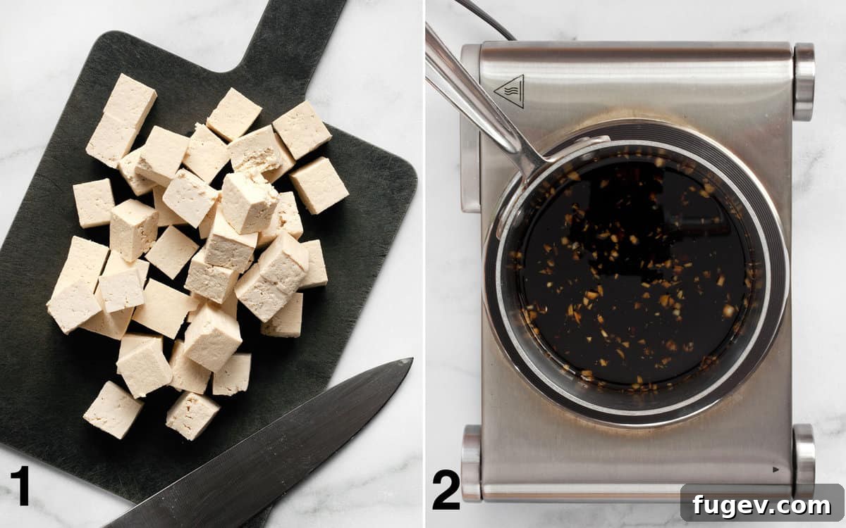 Glazed Teriyaki Tofu & Broccolini Sheet Pan Meal 4 Cube tofu on a cutting board. Teriyaki sauce in small pot on the stove.