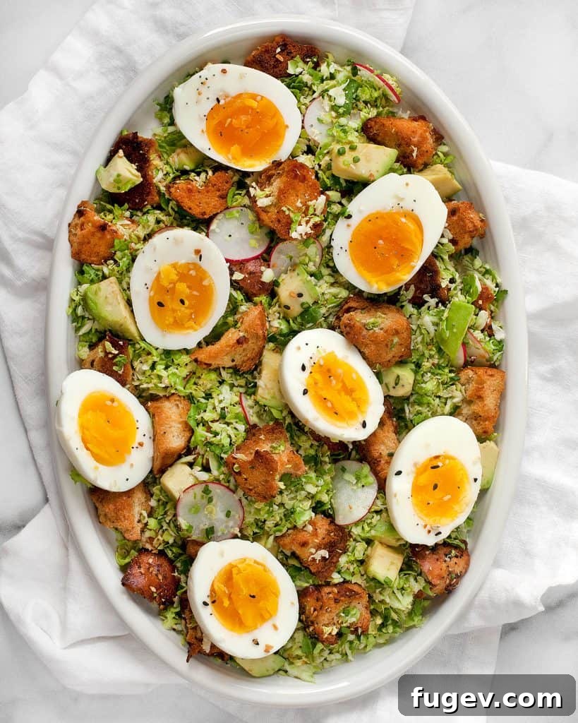 Sunrise Sprout Salad 3 Brussels sprout salad with hard-boiled eggs and savory bagel croutons for a fulfilling breakfast