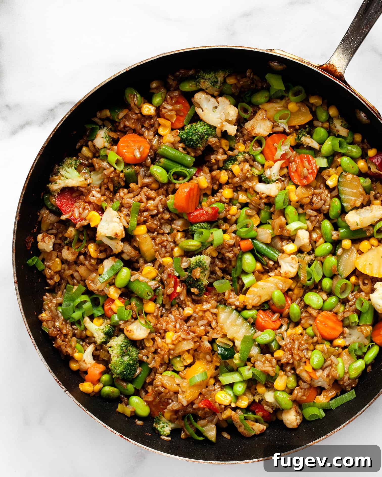 Freezer-Fresh Stir-Fry Bliss 6 Frozen vegetable stir-fry with rice in a skillet, ready to be served.