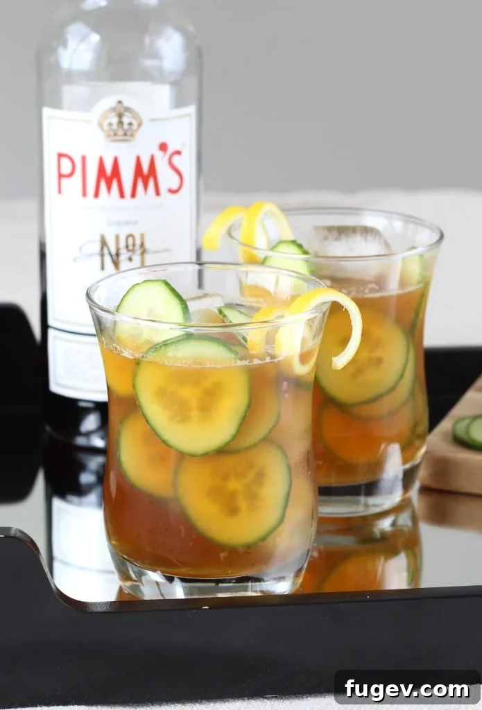 Garden Fresh Pimm's Cooler 2 Refreshing Cucumber Pimm's Cup cocktail with lemon and cucumber slices