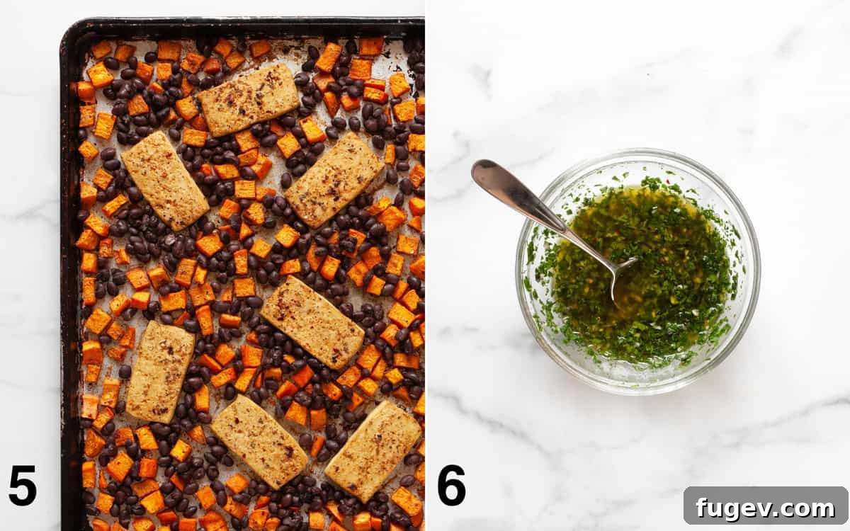 Hearty Sheet Pan Tofu Sweet Potato Black Bean Dinner 6 A sheet pan filled with roasted tofu, sweet potatoes, and black beans, alongside a bowl of freshly prepared chimichurri sauce.