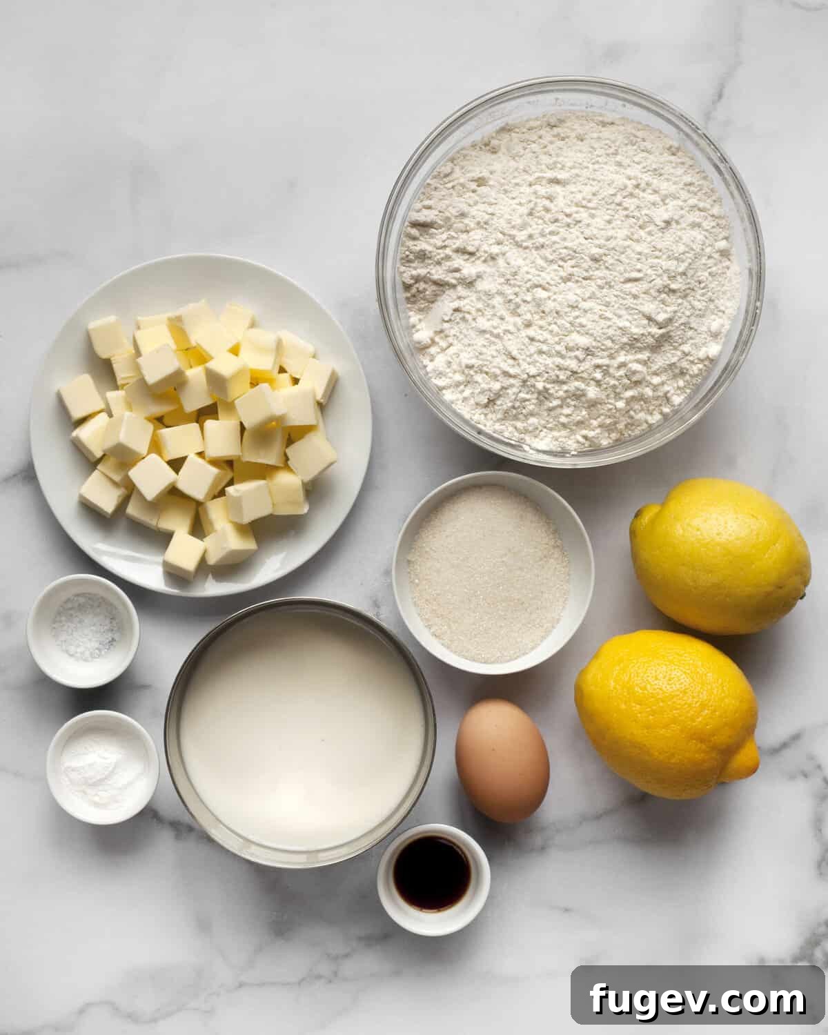 Sunshine Lemon Scones 3 Array of scone ingredients: flour, butter, sugar, lemons, baking powder, egg, vanilla extract, and salt