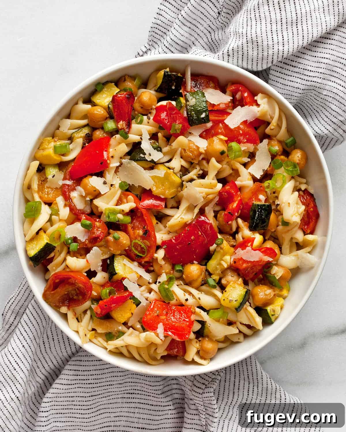 Mediterranean Roasted Vegetable & Chickpea Pasta 7 A close-up of the roasted vegetable chickpea pasta salad in a rustic bowl, ready to be served.