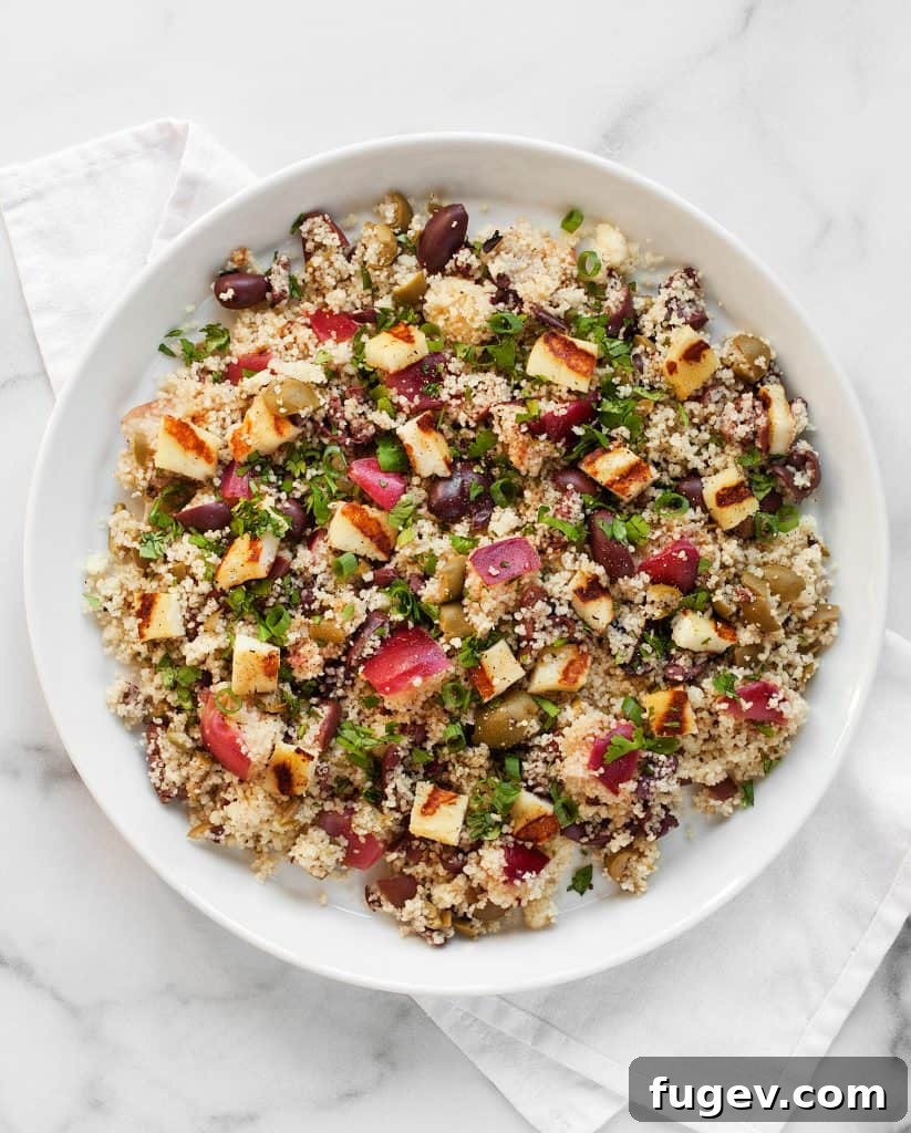 Vibrant Grilled Nectarine Halloumi Couscous 3 Couscous with grilled halloumi and nectarines, showcasing fresh ingredients and vibrant colors
