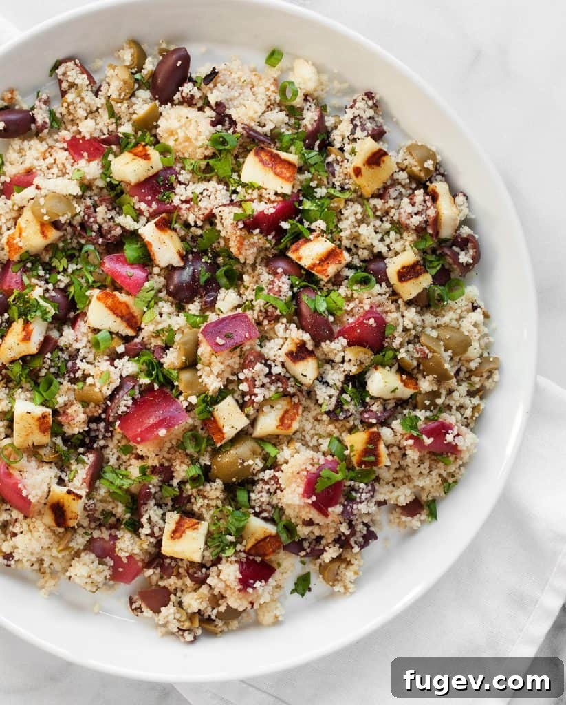 Vibrant Grilled Nectarine Halloumi Couscous 5 Grilled Nectarine Halloumi Couscous, close-up of the textured couscous with colorful additions