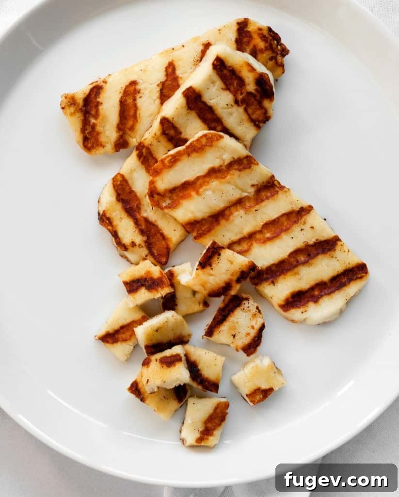 Vibrant Grilled Nectarine Halloumi Couscous 6 Grilled halloumi cheese slices with distinct grill marks on a plate