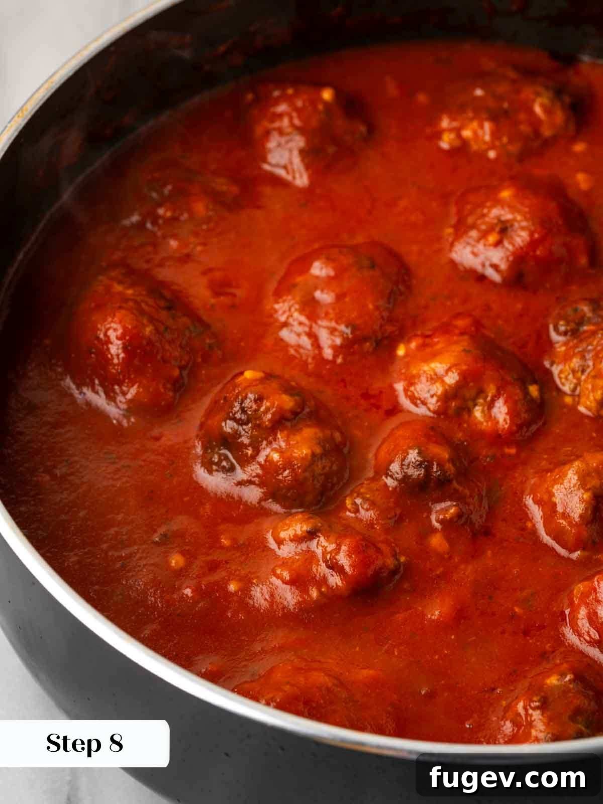 Cloud-Like Ricotta Meatballs 10 Perfectly browned meatballs simmering in a rich red tomato sauce, absorbing flavors.