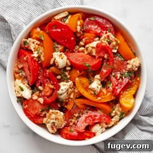 Vibrant Heirloom Tomato and Mozzarella Salad 7 Heirloom tomato salad in a large bowl, ready to be served.