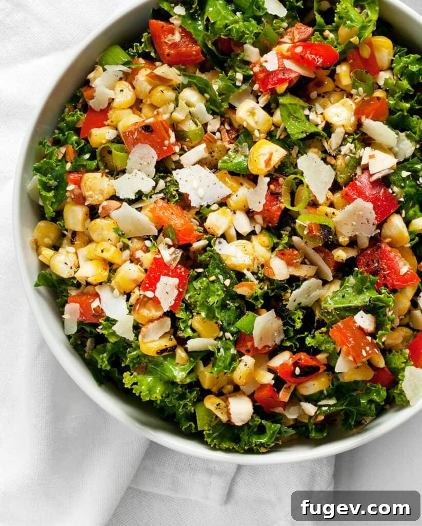 Grill-Kissed Corn and Pepper Kale Crunch 3 Close up of kale salad with grilled corn and red peppers