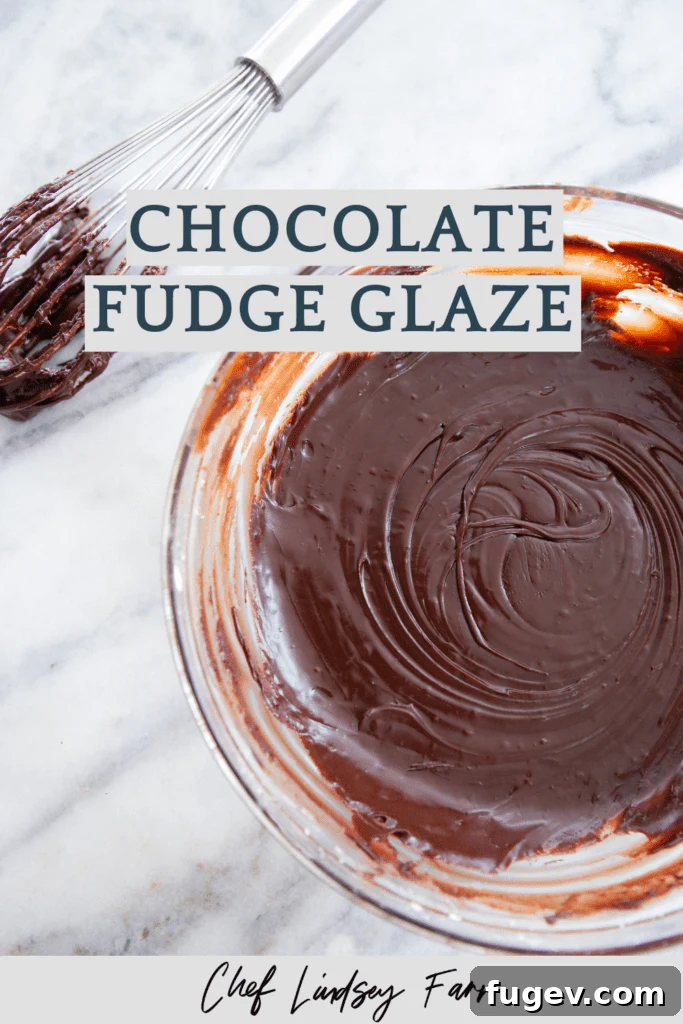 Decadent Fudge Drizzle 6 Chocolate Fudge Glaze spooned onto a dessert, showing its rich and glossy finish.