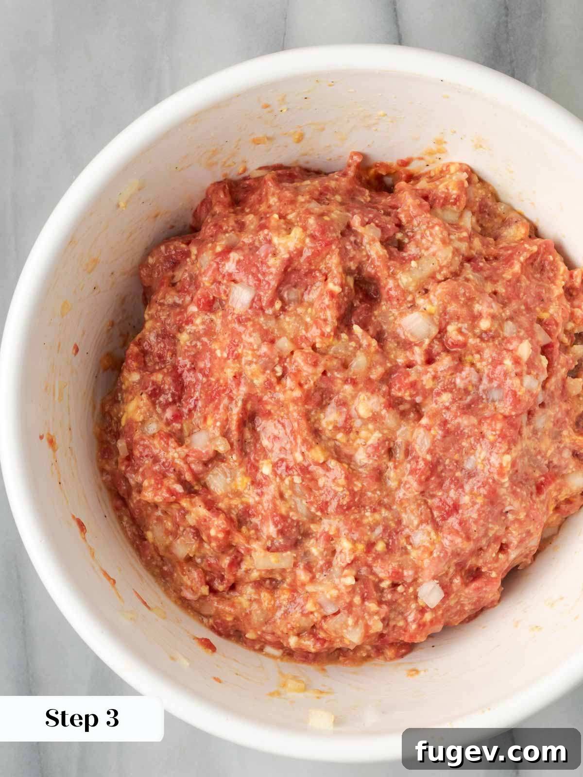 Sticky-Sweet Brown Sugar Meatloaf 6 Meatloaf mixture thoroughly mixed in a white bowl, ready for shaping.