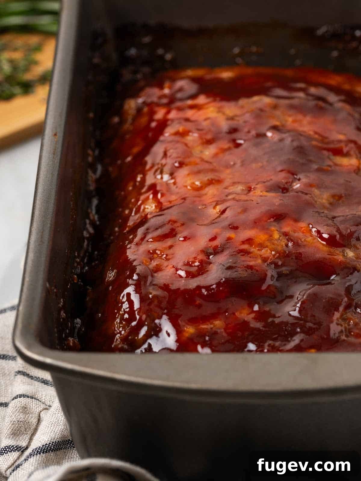 Sticky-Sweet Brown Sugar Meatloaf 8 Baked brown sugar glazed meatloaf in its pan, rich and caramelized.