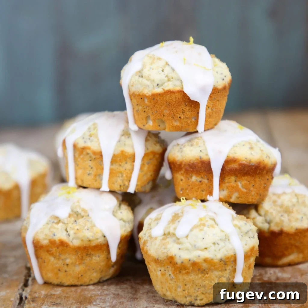 Zesty Lemon Poppyseed Muffins 6 A stack of three Lemon Poppy Seed Muffins, beautifully presented