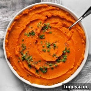 Mashed sweet potatoes in a bowl.