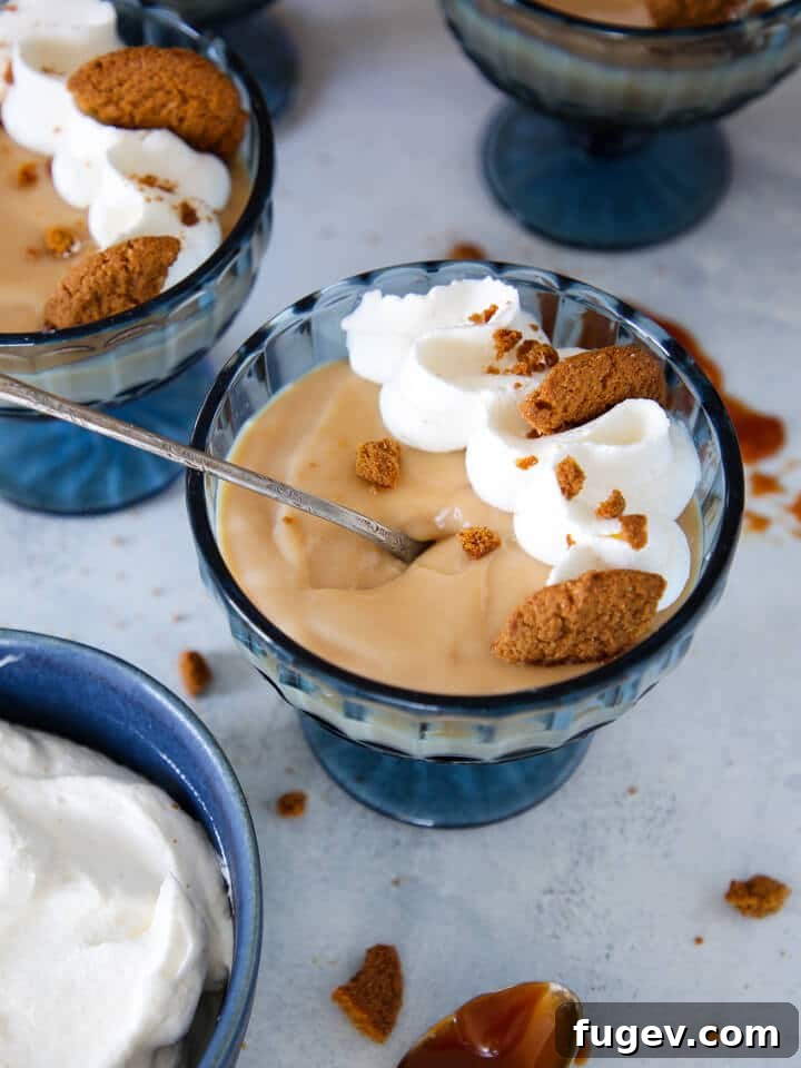 Decadent Caramel Pudding 2 A rich caramel pudding served elegantly with a silver spoon, highlighting its smooth texture and deep color.