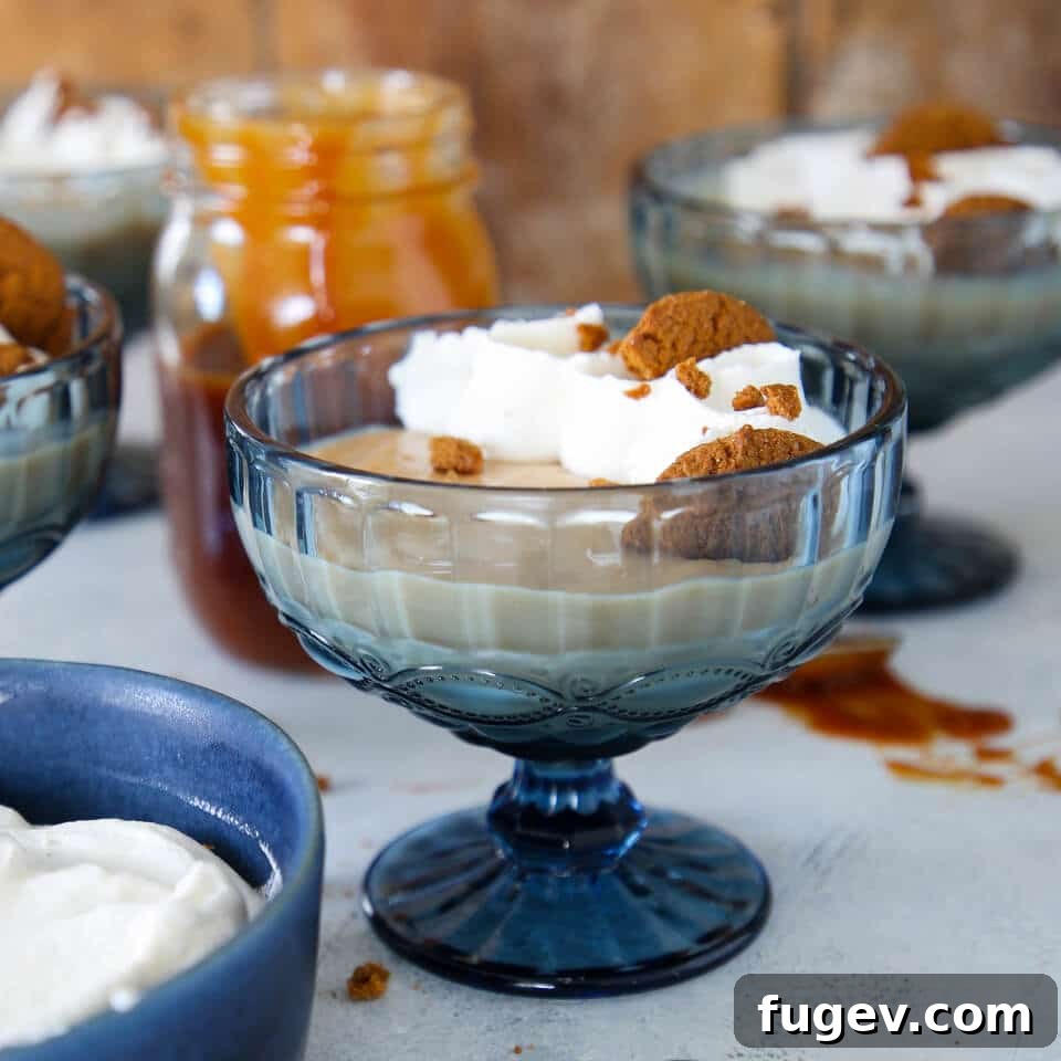 Decadent Caramel Pudding 3 A vibrant blue cup holds a generous serving of creamy caramel pudding, ready to be enjoyed.