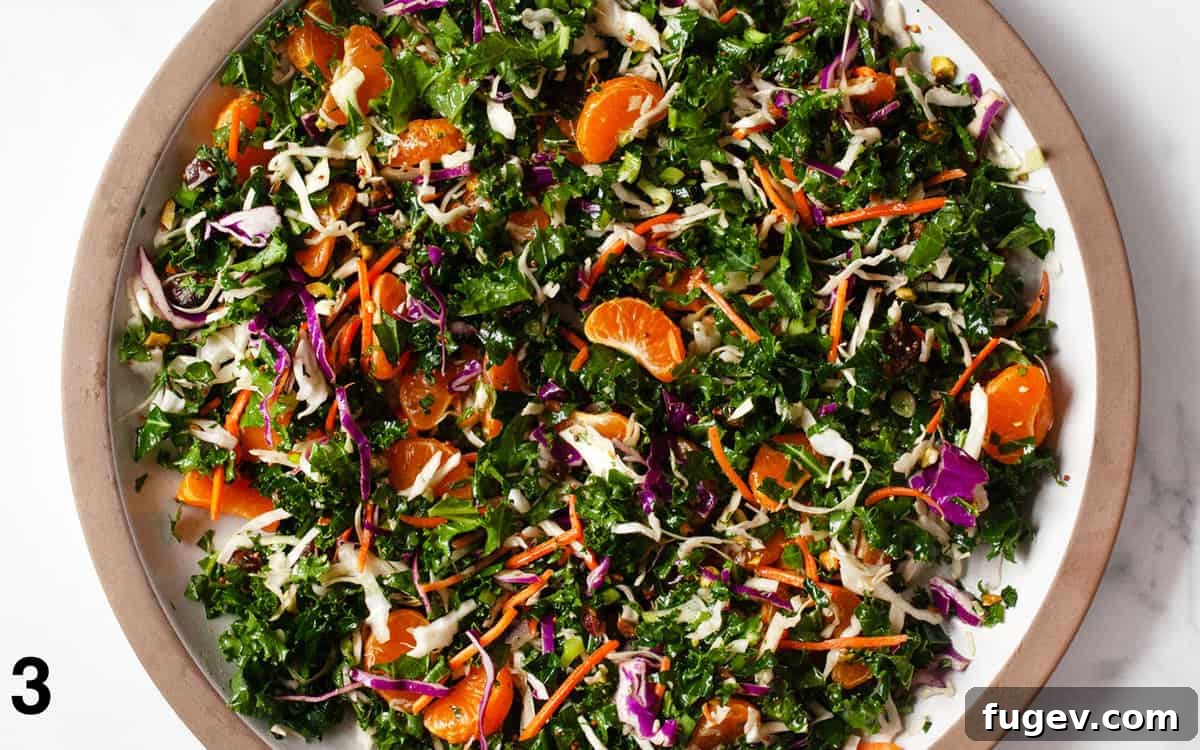 Zesty Mandarin Salad 5 A vibrant Mandarin Orange Salad, fully tossed and coated with vinaigrette, served in a large mixing bowl, ready to be enjoyed.