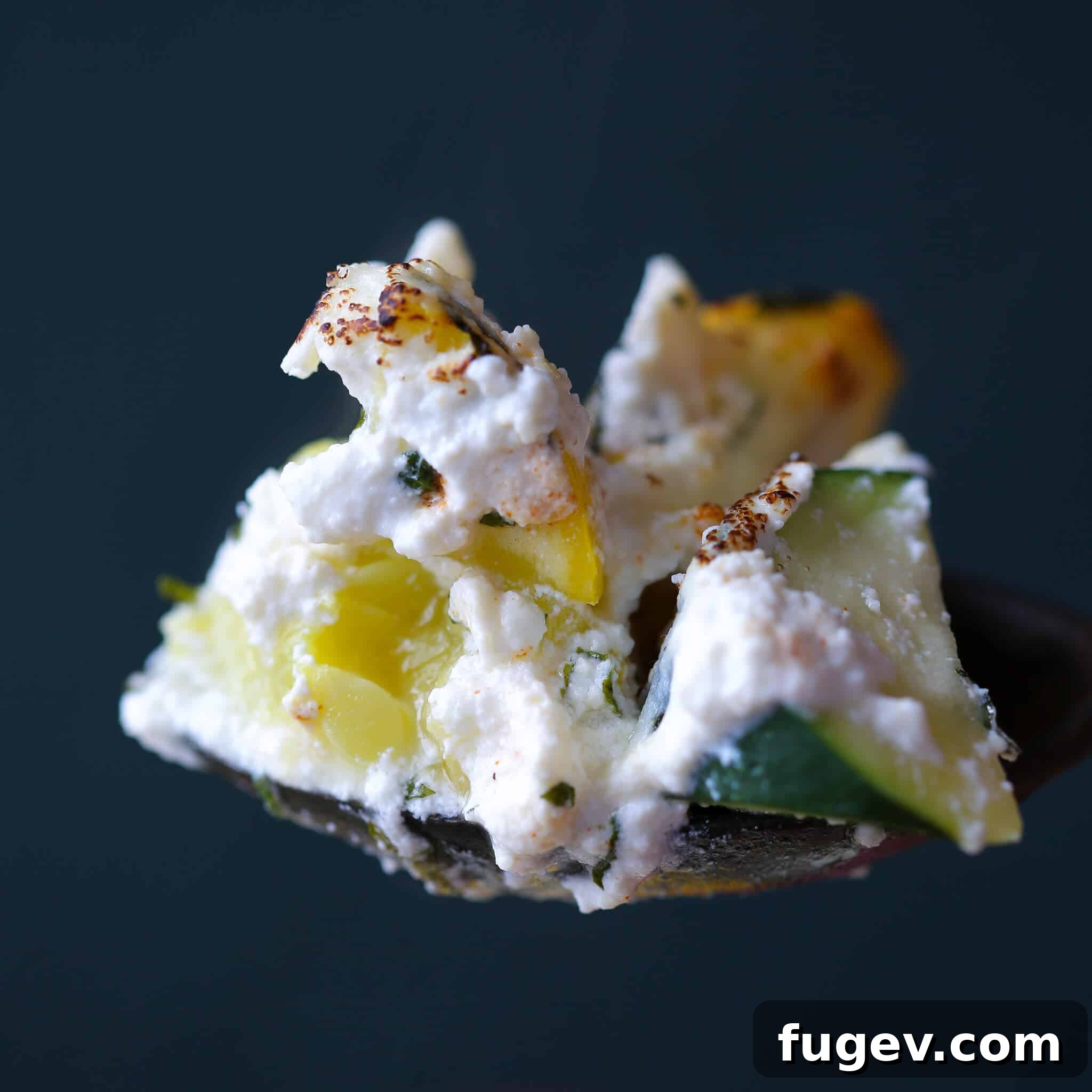 Creamy Zucchini Ricotta Gratin 6 Zucchini Ricotta Casserole on serving spoon